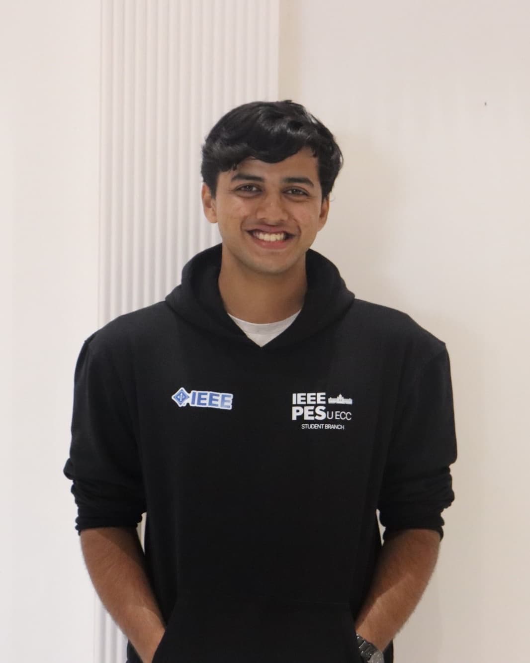 Anupam G smiling, in a black IEEE student branch hoodie